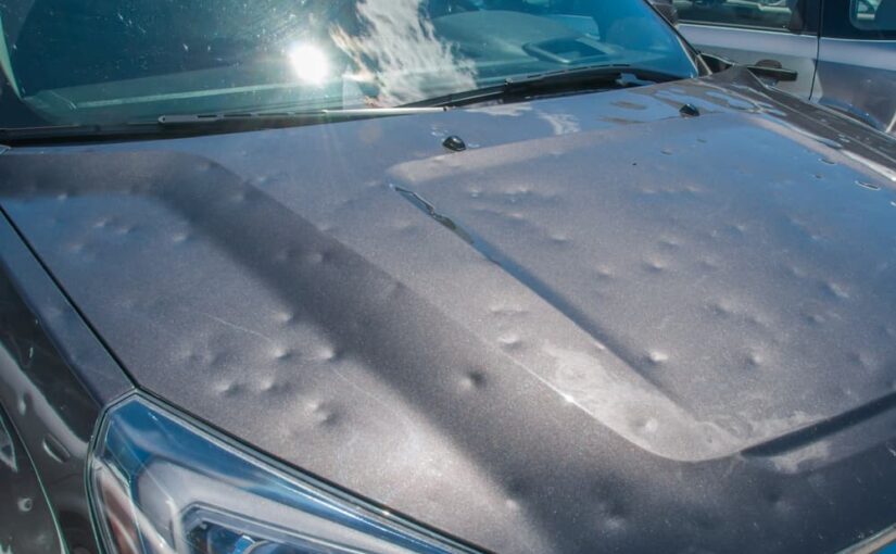 Hail damage on the hood of a car